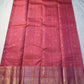 Peach Pink Flower Butta – Coral-pink shot body with micro checks & floral buttas

Handwoven Kanchipuram silk with delicate copper-pink zari work

Elegant floral vines on borders • grand rose-gold brocade pallu

Silk Mark Certified | Fall & Pico Done |