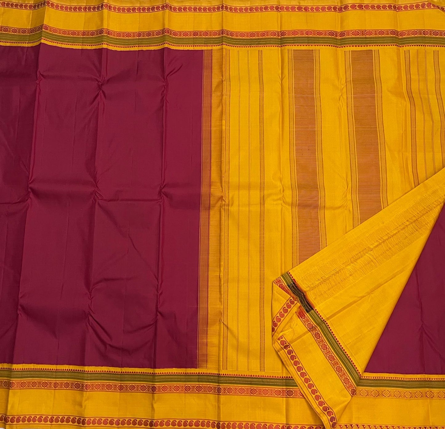 Turmeric Saffron Rettapettu — Pure Kanchipuram Silk
Rani pink body with saffron-yellow twin rettapettu borders & temple thread motifs
Silk Mark Certified • Free Shipping within USA • Ships in Two Weeks