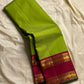 Maavilai Arakku Chakram — Korvai Kanchipuram Pure Silk

Parrot-green vaira-oosi body with soft pin-stripe sheen

Contrast arakku/rani border with gold chakram medallions & temple motifs

Arakku pallu with all-over coin-jaal; contrast blouse included
