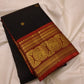 Intricate gold zari pallu detail on black Kanchipuram saree