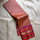Valli – Handwoven Terracotta Blush Kanchipuram Silk Saree Featuring Intricate Mayil Butta and a Dual-Tone Varisaipet Border in Plum and Vermilion, Adorned with Temple-Inspired Zari motifs