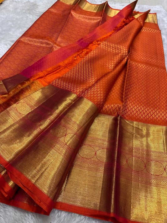 Drenched in a bold, luminous orange, a true showstopper in every way.pure silk and pure Zari 3g Kanchipuram silk saree
