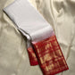 A true festival essential white with dashing red pure silk Kanchipuram saree with a kamalam and mayil detailed border zari work , red reku and Pallu