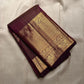 Varnika – Handwoven Kanchipuram Silk Saree in Plum Wine
A regal plum Kanchipuram silk saree adorned with gold zari paisleys and Gandaberunda motifs