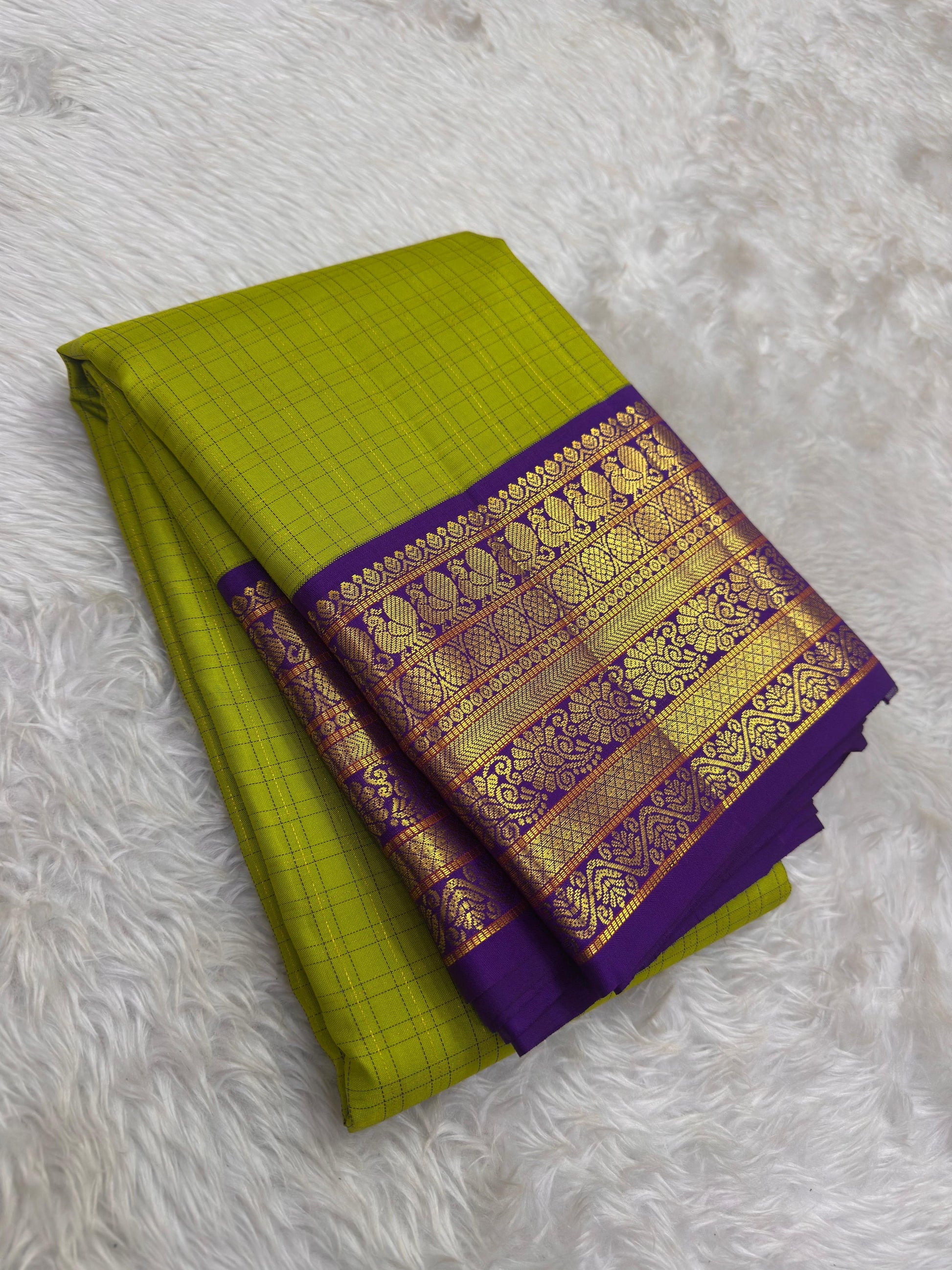 Traditional Kanchipuram Korvai saree in olive chartreuse green with separately woven royal purple border