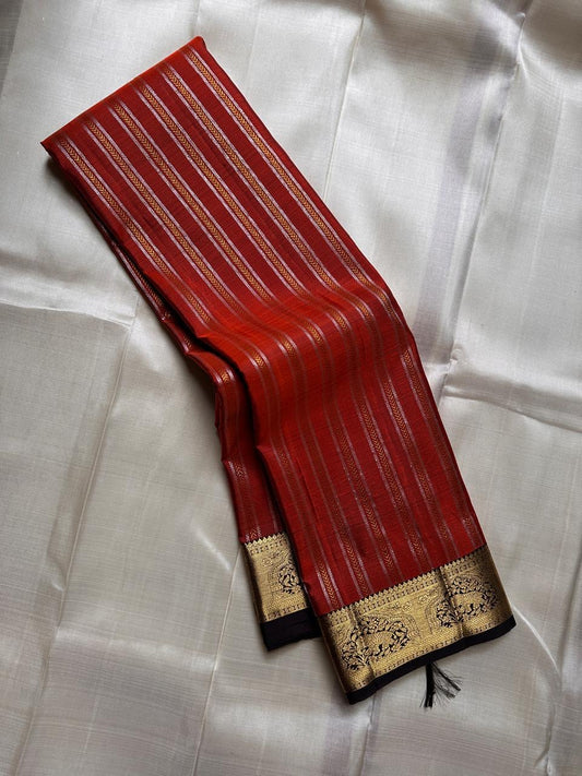 Tamra — Rust Vairaoosi Kanchipuram Pure Silk

 

Coffee Brown Korvai Border & zAri Pallu

 

elephant motifs  Medallions & Annam Panels in Gold Zari

 



Silk Mark Certified | Free Shipping within USA

 

Ships in Two Weeks | Blouse Stitching $30