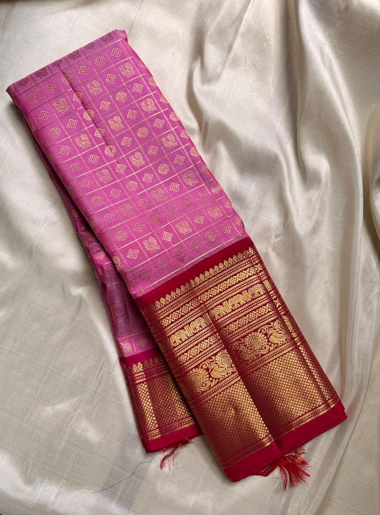 Pure silk Zari kattam butta pink and red saree with peacock, kamalam and kolam motifs