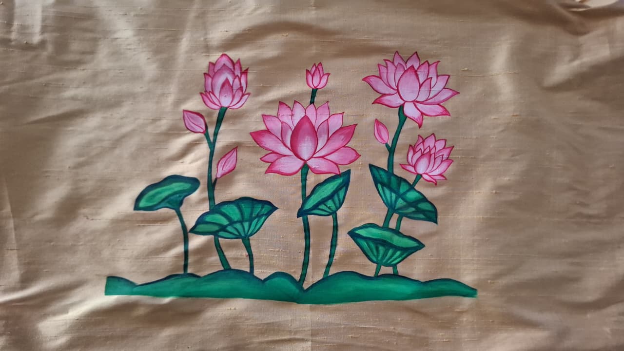 Artisan hand painting lotus motif on pure silk blouse fabric