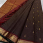 Folded deep brown pure silk Kanchipuram saree with maroon and green contrast border