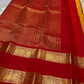 Festive red and mustard pure silk Kanchipuram saree folded display