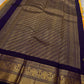 Pure Kanchipuram Silk Saree – Saffron-Orange Body with Gold Zari Paisley Buttas
Contrast Deep Purple Korvai Borders with Intricate Temple & Floral Motifs
Grand Purple Zari Pallu with Diagonal zariWeave . Silk mark , ships in 2 weeks