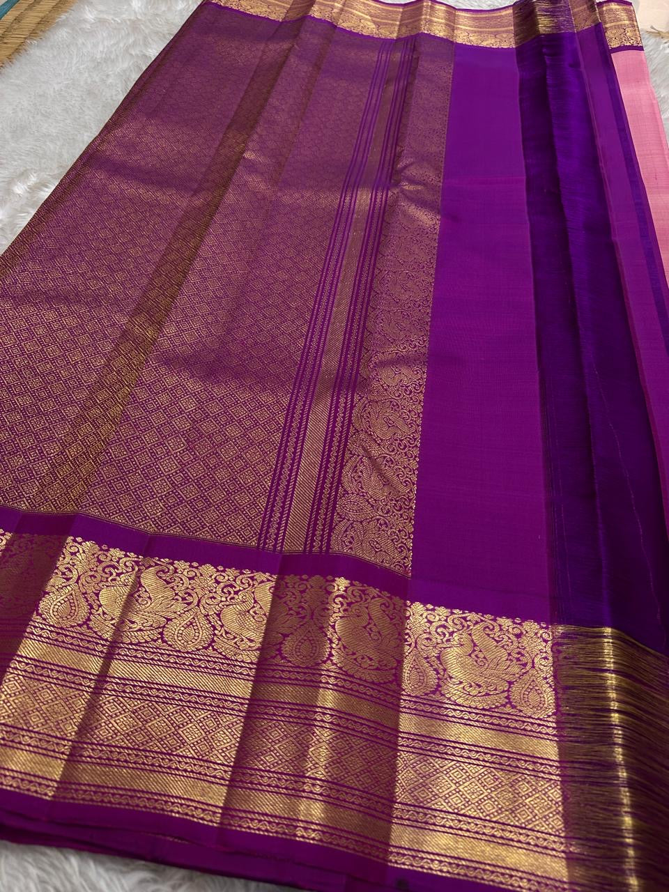 A dazzling blend of pink and purple silk, enriched with golden zari for a look that’s both festive and feminine.