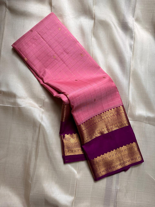 Blush Lattice – Pure Kanchipuram Silk Saree
Pleasant Pink Body with Zari Kattam Checks
Petite Kamalam Buttas Scattered Across the Body
Contrast Purple Rettapet Border with Ornate Motifs
Grand Purple Pallu. Silk Mark Certified, delivery in 2 weeks