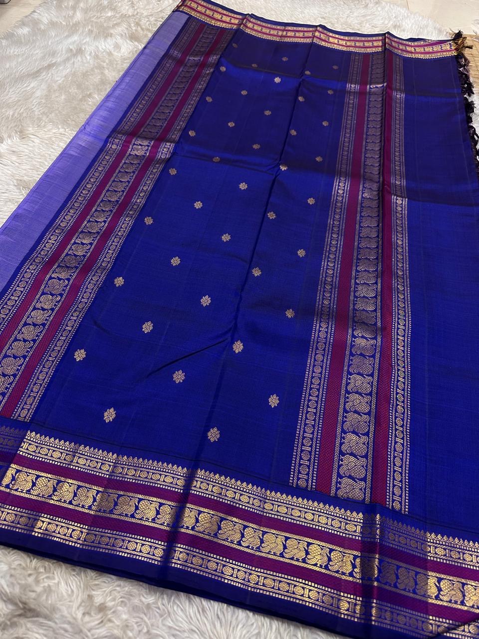 Lilac Indigo Pattu Butta — Pure Kanchipuram Silk Saree
Soft lilac body with indigo flower buttas, rich indigo–magenta gold zari borders and a grand indigo pallu.
Silk Mark Certified • Free Shipping within USA • Ships in Two Weeks