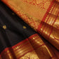 Deep black pure silk Kanchipuram saree with mayil chakram butta and traditional gold zari border