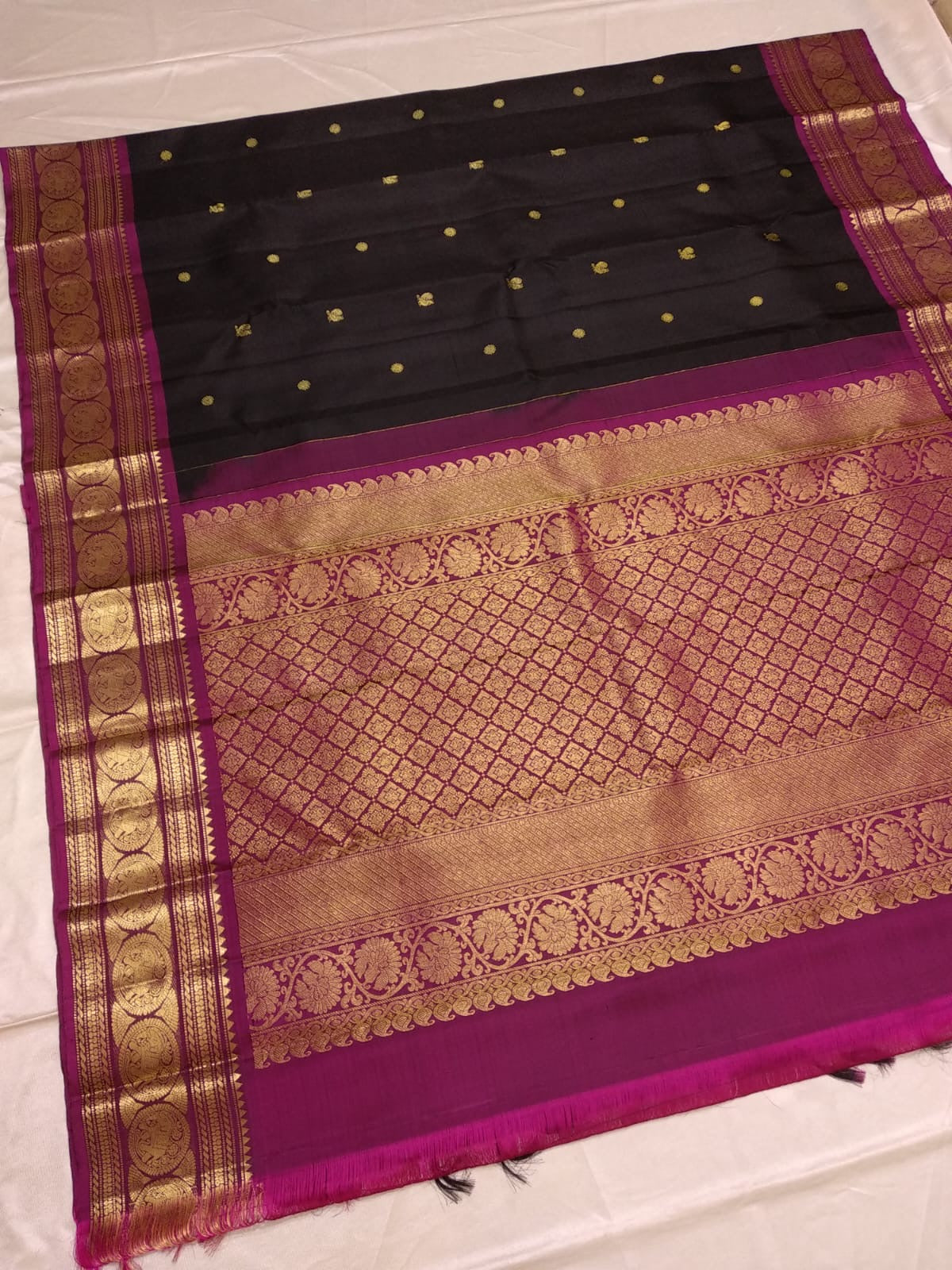 Close view of antique gold zari Mayil Chakram peacock motifs