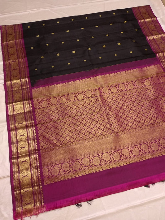 Close view of antique gold zari Mayil Chakram peacock motifs