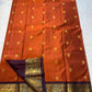 Rust Orange & Wine Korvai – Pure Kanchipuram Silk Saree
Burnt rust-orange shot body with dainty gold paisley buttas
Deep wine korvai borders in antique gold—Annapakshi & Yaali medallions
Grand wine pallu with full-zari jaal & temple panels
Silk Mark