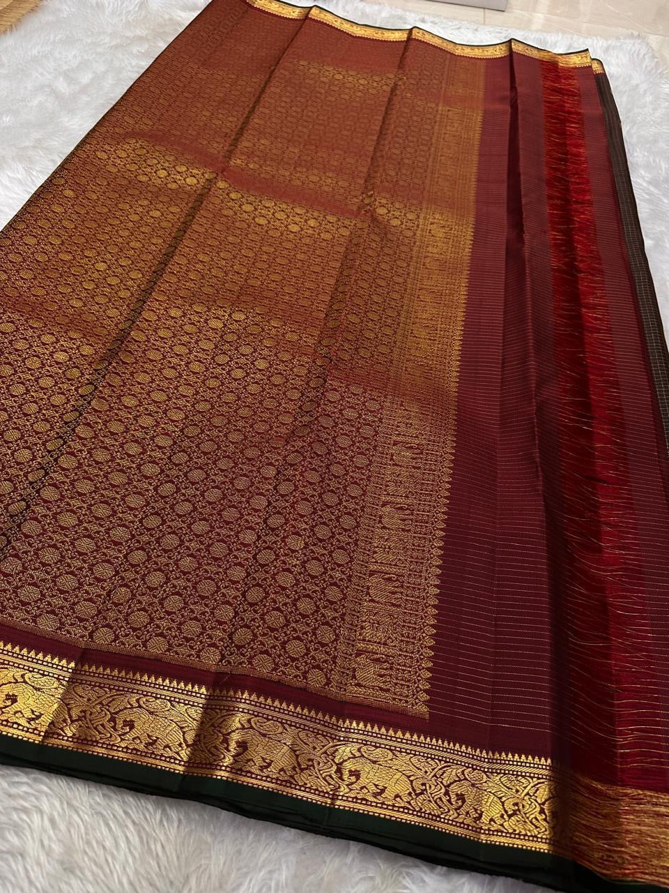 Brown zari kattam Kanchipuram silk saree with delicate gold leaf motifs