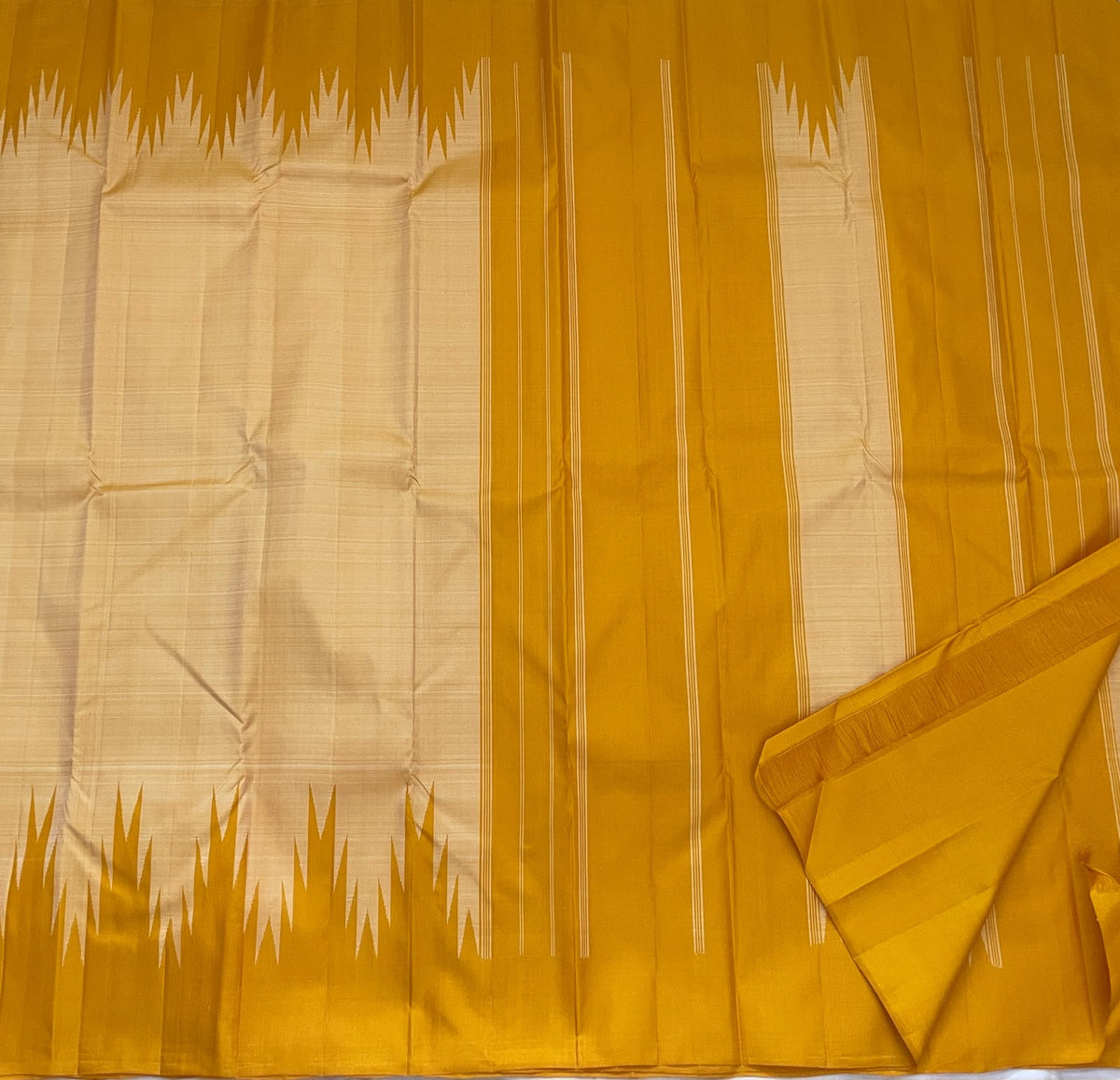 Traditional Thazampoo Reku Kanchi pattu saree in golden mustard and sandalwood ivory handwoven silk.