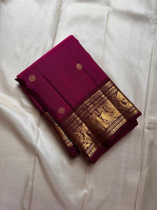 Mythili – Deep Pink Kanchipuram Silk Saree with Kamalam Buttas
Intricately woven with Vanasringaram motifs in a regal brown border
A heritage drape featuring elephants, peacocks & Rudhraksham