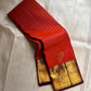 Rust Orange Chakram — Korvai Kanchipuram (Pure Silk)

Deep Aubergine Contrast Border & Diamond-Jaal Pallu

Peacock–Mango (Mayil–Mankolam) Zari Panels • Temple Edging

Handloom • Running Contrast Blouse with Zari Border

Silk Mark Certified • Ships in Two