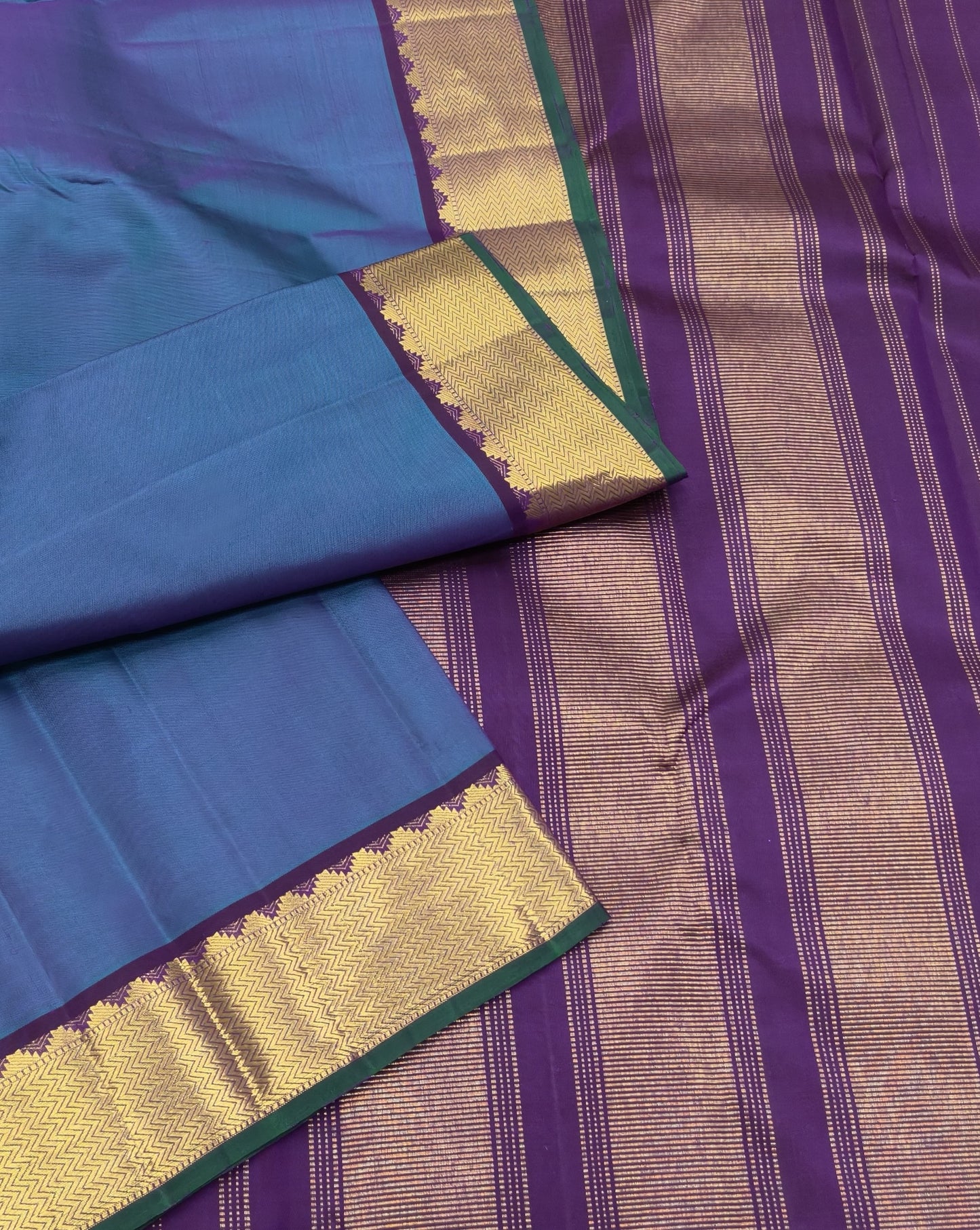 Handwoven Kanchipuram silk saree midnight indigo blue with dense zari small border – drape detail