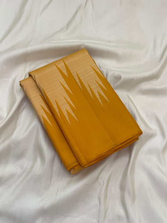 Golden mustard Kanjivaram pure silk pallu featuring pale ivory geometric panels and fine woven vertical lines.