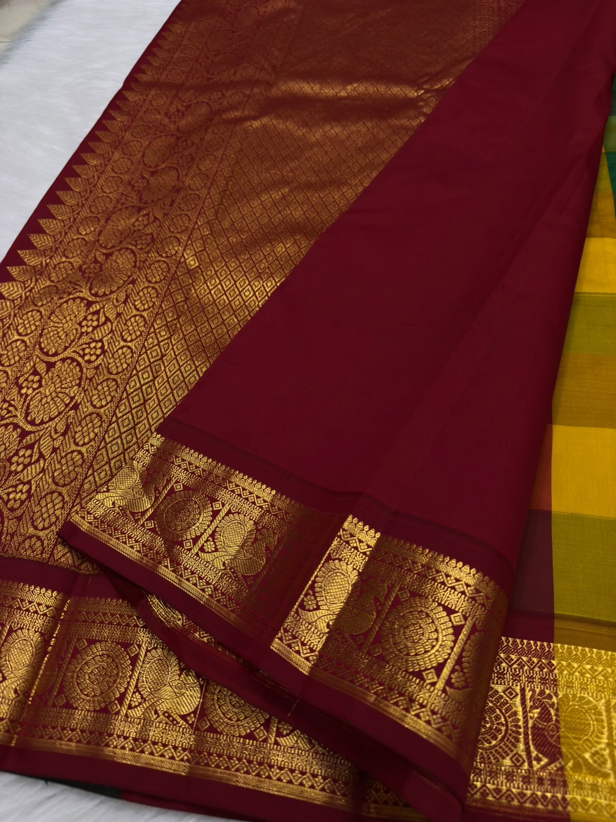 Self-colour emerald green blouse piece included with Kancheepuram Paalum Pazhamum saree