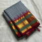 Onyx Plaid – Pure Kanchipuram Silk Saree
Black & Ivory Micro-Checks Body (Kattam) ✨
Parrot-Green Korvai Border with Gold Zari
Crimson Pallu with Orange Panel & Kaddi Stripes

Silk Mark Certified, delivery in 2 weeks