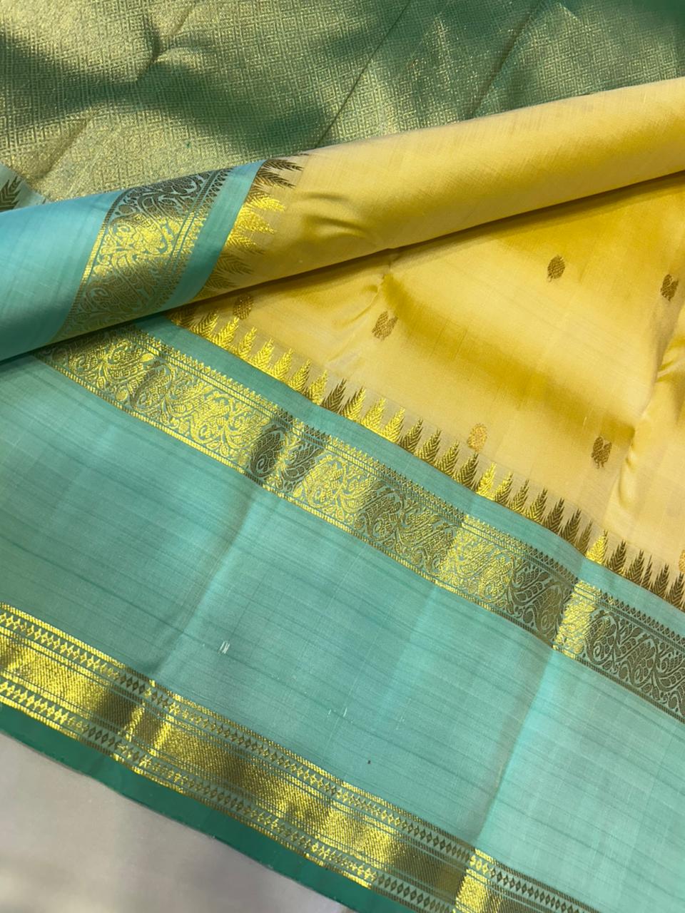 Sunlit Butter Yellow ✨ – Pure Kanchipuram Silk Saree in Butter Yellow & Sea Green with Gold Zari Temple Border & Grand Brocade Pallu – Silk Mark Certified, Fall & Pico Done, Blouse Stitching Available, ships in 2 weeks