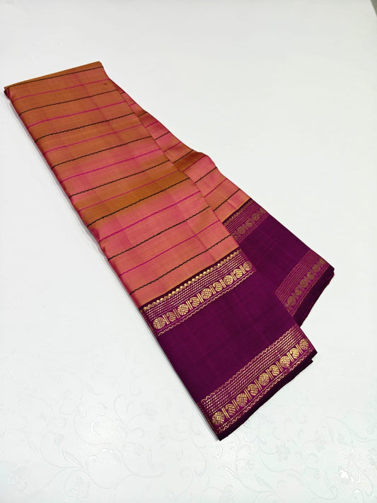 Shanmugapriya – Pure Kanchipuram Silk Saree
Plum Body with Veldhari Silk Thread Lines ✨
Contrast Korvai Borders with Gold Zari Motifs
Grand Zari Brocade Pallu with Traditional Detailing
Silk Mark Certified | Blouse Piece Included | ships in two weeks