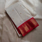Banu – Off-White Kanchipuram Pure Silk Saree with pure 3gm Zari Kattam & Deep Red-Pink Shot color Border with elegant and peacock motifs