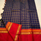 Rani Maragatham Zari Kattam — Pure Silk Kanchipuram (Handloom)
Purple  body with fine gold kattam checks & zari lines • Vibrant vermillion red border with temple coin motifs
Rich red  pallu with antique-gold zari panels • Silk Mark Certified ✅