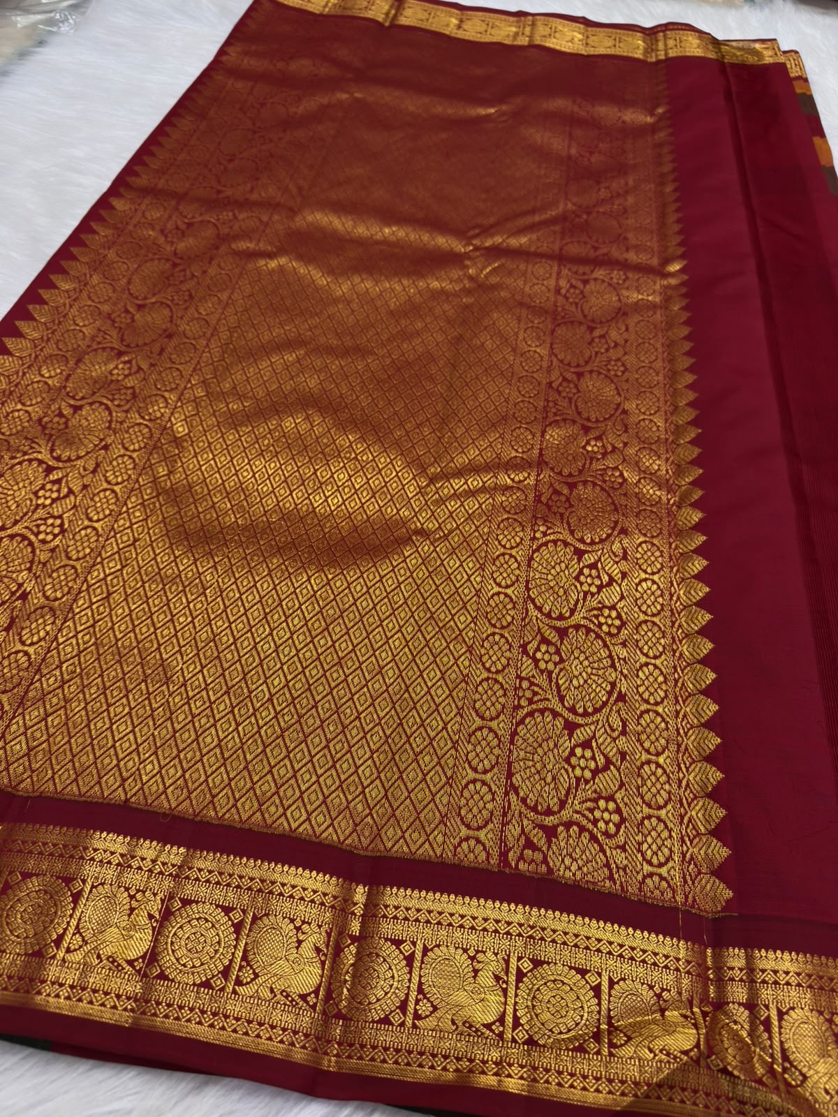 Close-up of hand-woven zari detailing on Kancheepuram Paalum Pazhamum silk saree
