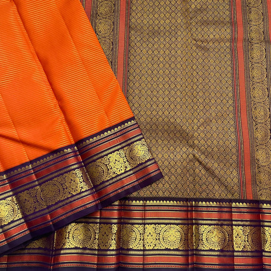 Kesari Annapakshi Chakram
Pure Kanchipuram Silk Saree – Vibrant Kesari Orange Body with Gold Zari Chakram Buttas
Deep Purple Korvai Borders with Majestic Annapakshi & Floral Motifs
Grand Purple Zari Pallu. Silk mark certified , ships in 2 weeks