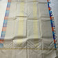 Venpattu Kattam Thazampoo Reku – ivory/venpattu borders with multicolor kattam (checks) body

Pure Kanchipuram silk • rani pink, tangerine, purple, sky blue & steel grey checks with thazampoo reku edging

Ivory pallu with gold tissue stripes & multicolor