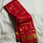 Ravi Kiranam — Sona Roopa Kattam Kanchipuram Pure Silk

Vibrant festive red body with allover kattam (grid) checks

Gold & silver sona-roopa zari alternating for a soft shimmer

Grand kaddi border with rich zari paisley vines & floral tracery

Silk Mark