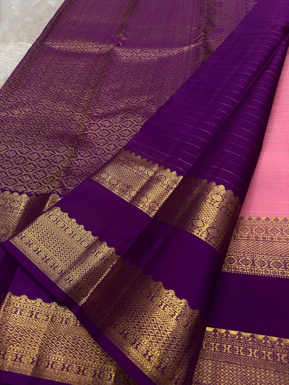 Blush Lattice – Pure Kanchipuram Silk Saree
Pleasant Pink Body with Zari Kattam Checks
Petite Kamalam Buttas Scattered Across the Body
Contrast Purple Rettapet Border with Ornate Motifs
Grand Purple Pallu. Silk Mark Certified, delivery in 2 weeks