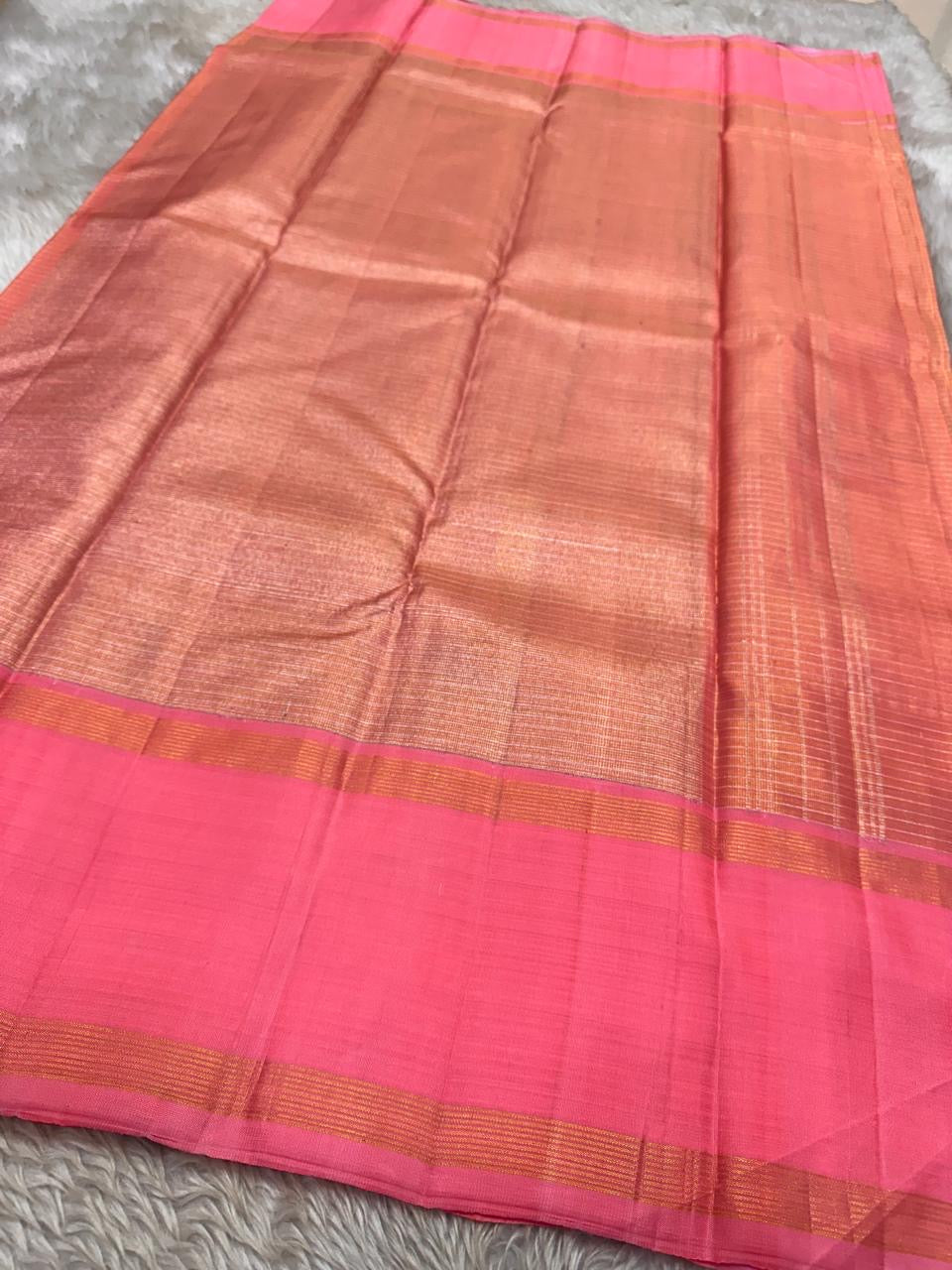 muthyam 🌸✨
Rose Pink & Coral Peach Pure Kanchipuram Silk Saree 💖
Soft Rose Pink Body with Subtle Golden Zari Checks ✨
Coral-Peach Minimalist Borders & Elegant Horizontal Pallu Detailing 🌿
Silk Mark Certified ✅ Lustrous Handwoven saree