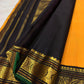 Turmeric yellow Kanchi Pattu silk body with needle-fine vertical Oosi Vaanam zari lines and small gold zari buttas.