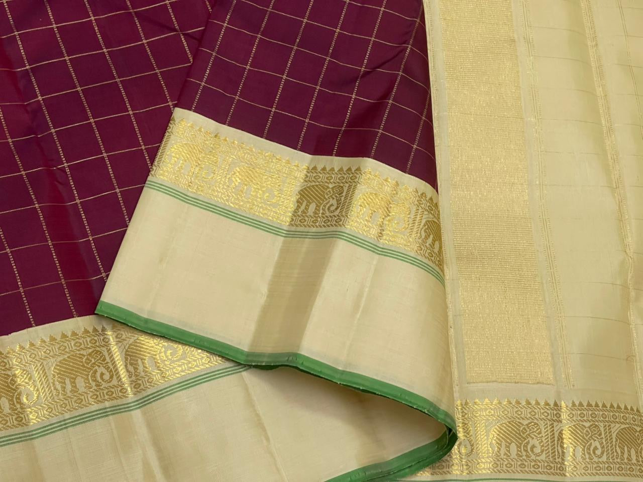 Kanchana Checks — Pure Kanchipuram Silk
Jamuni Gold Grid × Ivory border  with Gaja Zari
Ivory Zari Pallu • Contrast Jamuni Blouse
Silk Mark Certified • Free Shipping within USA
Dispatch in 1 Week • Ships in Two Weeks