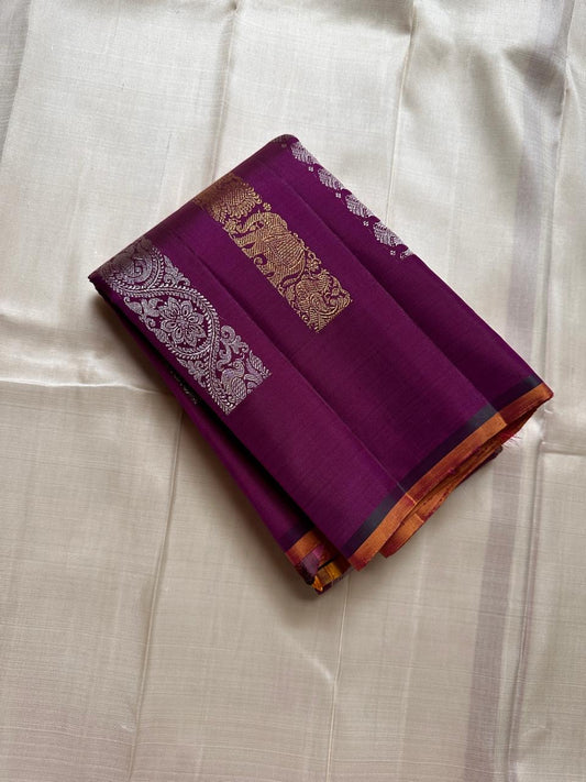 Lavanya– radiant purple Handwoven Kanchipuram Silk Saree in purple with Gold & Silver Zari, this deep purple Kanchipuram silk saree with intricate motifs in gold and silver zari, including Gandaberunda, parrots, elephants &lotuses as seen on Nita Ambani