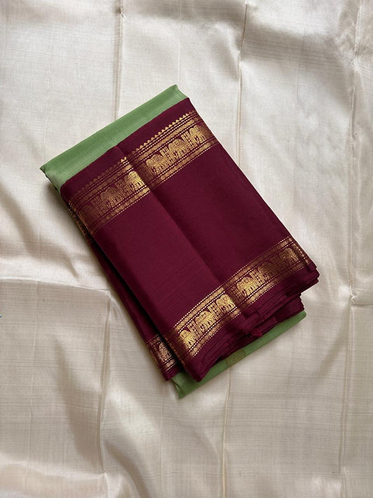 Samprada – Kanchipuram Silk Saree in vibrant cardamom Green & brown
A vibrant parrot green body meets a rich maroon border in this timeless Kanchipuram silk saree
