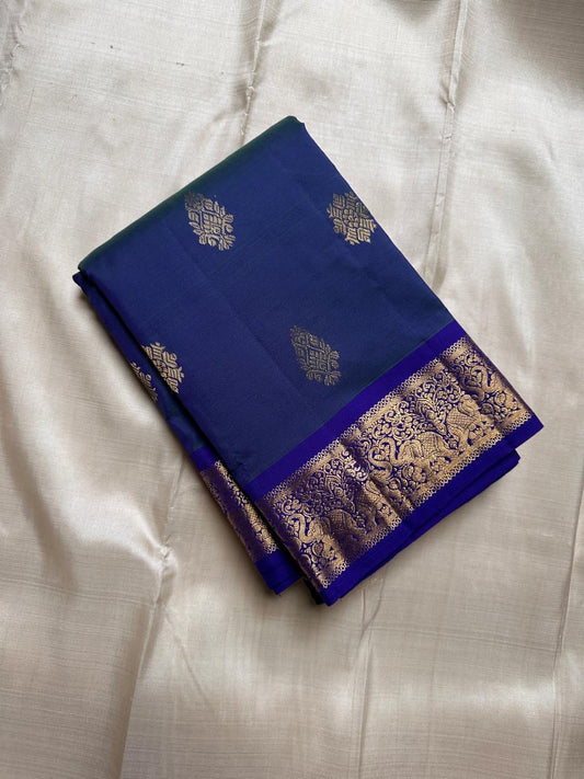 Swaram Lightweight – Peacock Dusk Blue
Feather-Light Peacock Blue Kanchipuram Silk Saree
Elephant & Tree of Life Zari-Woven Grandeur