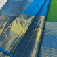 Parrot green Kanchipuram silk saree with gold zari coin buttas, contrast sky blue zari border and pallu