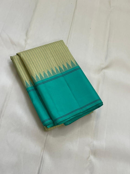 Cardamom Mist & Sea Green Kattam – Pure Silk Kanchipuram Saree
✨ Handwoven Pure Silk with Sea Green Body & Cardamom Checks
✨ Minimalist Korvai Border with Temple Motifs
✨ Contrast Pallu with Subtle Zari Highlights
✨ Silk Mark Certified, ships in 2 weeks