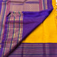 Swarna Kanakam Mayil Chakram — Pure Kanchipuram Silk Saree
Radiant turmeric-gold body adorned with silk-thread mayil and chakram buttas, framed by a regal vadamalli zari-woven korvai border and rich purple pallu.
Silk Mark Certified • Blouse Stitching Ava