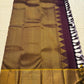 Full pallu layout of plum and gold Kanchipuram silk saree with traditional reku-style edging and tassels