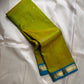 Citrus and Teal – Pure Kanchipuram Silk Saree
Dual-tone body in parrot green and turmeric.
Elegant gold leaf buttas across the drape.
Teal korvai border
Rich teal pallu with diamond jaal and temple motifs.

Silk Mark Certified, delivery in 2 weeks